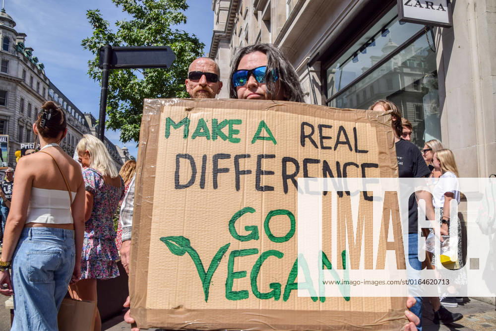 A protester holds a pro-vegan placard during the demonstration in Regent Street. Thousands of people marched through central London in support of animal rights and veganism, and called for an end to speciesism and all forms of animal exploitation. London United Kingdom - ZUMAs197 20220806_zaa_s197_220