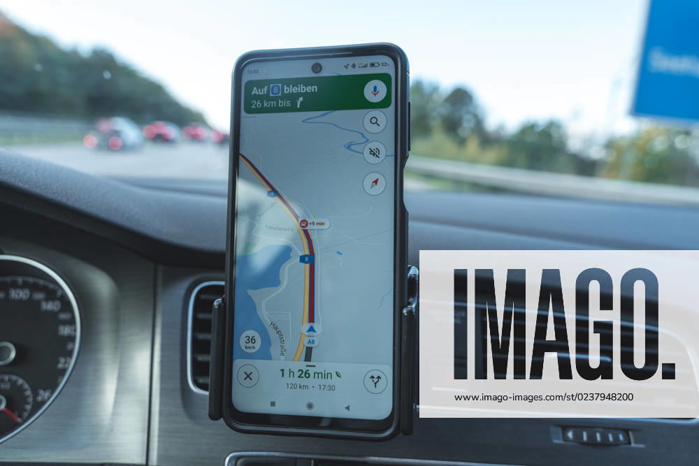 Bavaria, Germany - 3 October 2022: Google Maps navigation app in a car with a smartphone