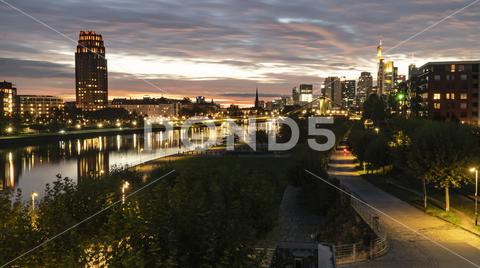 FRANKFURT am MAIN, GERMANY 2019 OCTOBER 05 Illuminated Cityscape Night View Frankfurt am Maine Germany architecture, background, brick, bridge, river, main, building, buildings, business, centre, city, cityscape, dark, downtown, editorial, europe, european, famous, frankfurt, frankfurt am main, mainhattan, germany, illuminated, park, sky, clouds, skyline, hotel, lindner, commerzbank