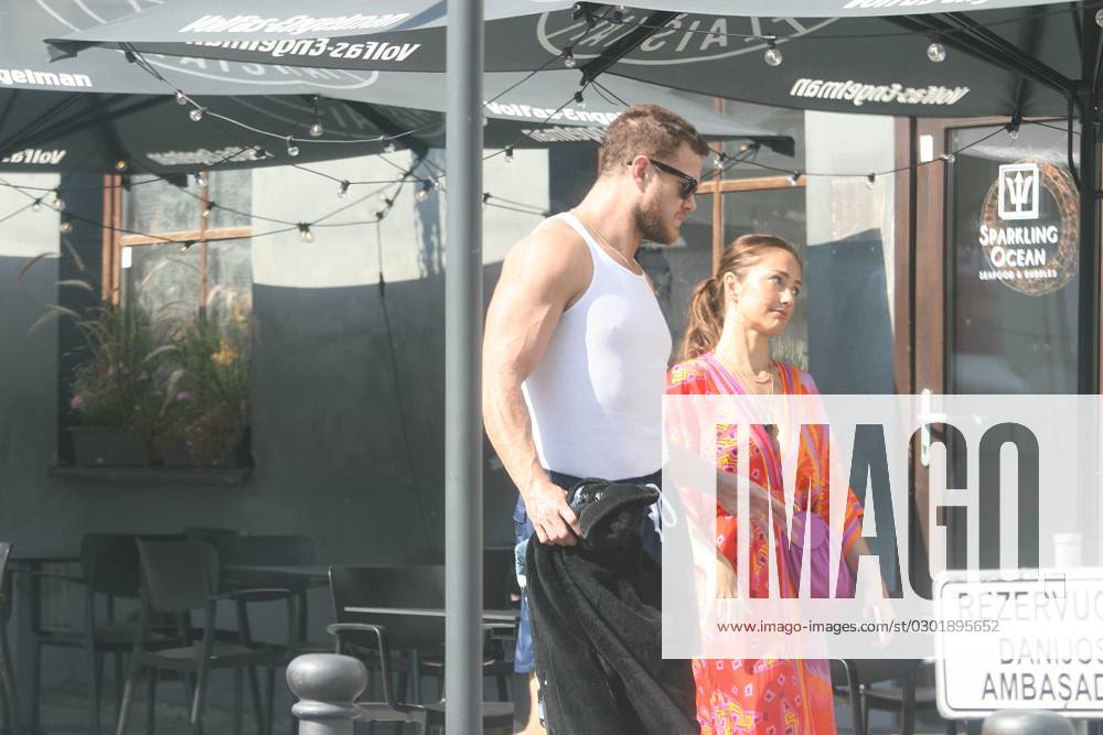 2023-08-17 Vilnius Lithuania. Lead singer of American rock band Imagine Dragons Dan Reynolds and Minka Kelly strolling in the Oldtown of Vilnius during heatwave on Thursday 17 of August 2023. Imagine Dragons had a show in Vilnius as part of Mercury World Tour on the eve. Vilnius Lithuania 65DM_20230817_0005
