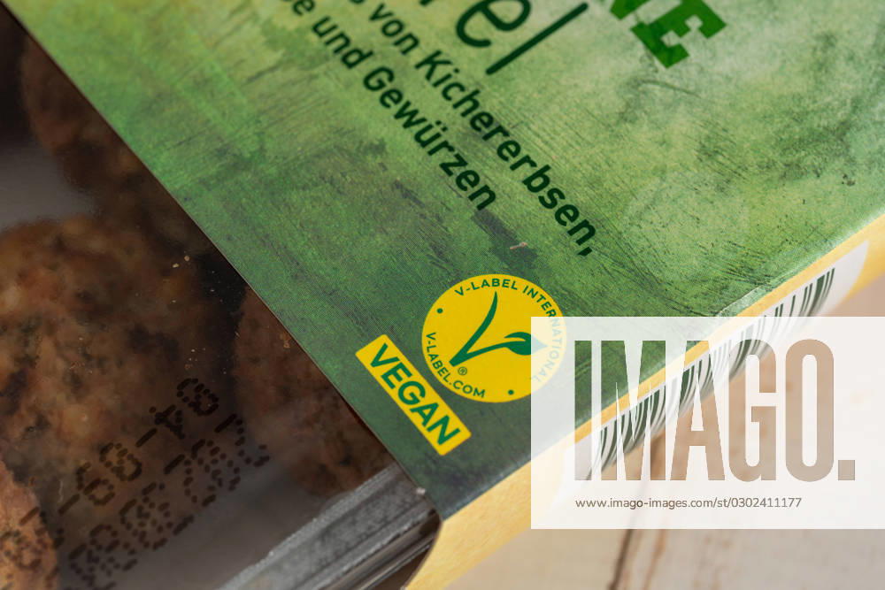 Augsburg, Bavaria, Germany - 29 August 2023: The V Label (European Vegetarian Union) on a package of vegan falafel. Vegan Food Label