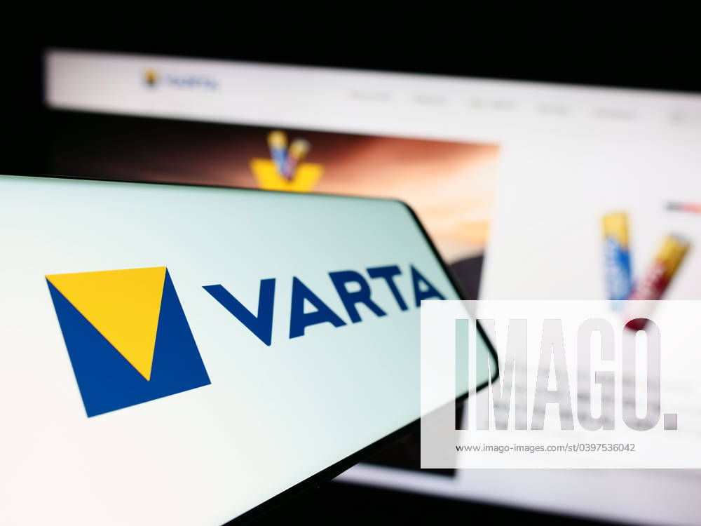 Mobile phone with logo of German battery company Varta AG on screen in front of business website. Stuttgart, Germany - 09-11-2023: Mobile phone with logo of German battery company Varta AG on screen in front of business website. Focus on left of phone display.