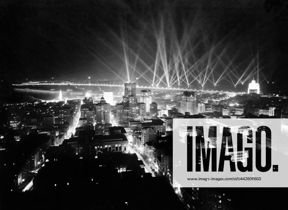 SAN FRANCISCO: NIGHT, 1936. Searchlights on the horizon of San Francisco, California, possibly in celebration of the opening of the Bay Bridge. Photograph