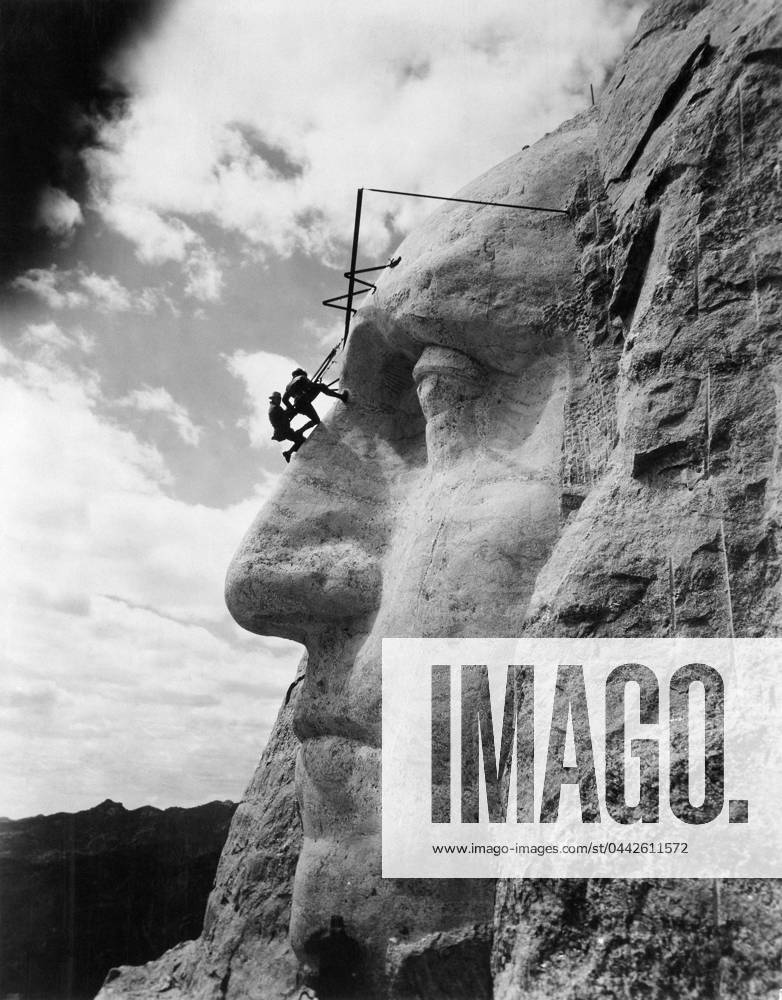 MOUNT RUSHMORE, c1932. American sculptor John Gutzon de la Monthe Borglum (1867-1941), inspecting work on the face of George Washington on Mount Rushmore in South Dakota. Photograph, c1932.