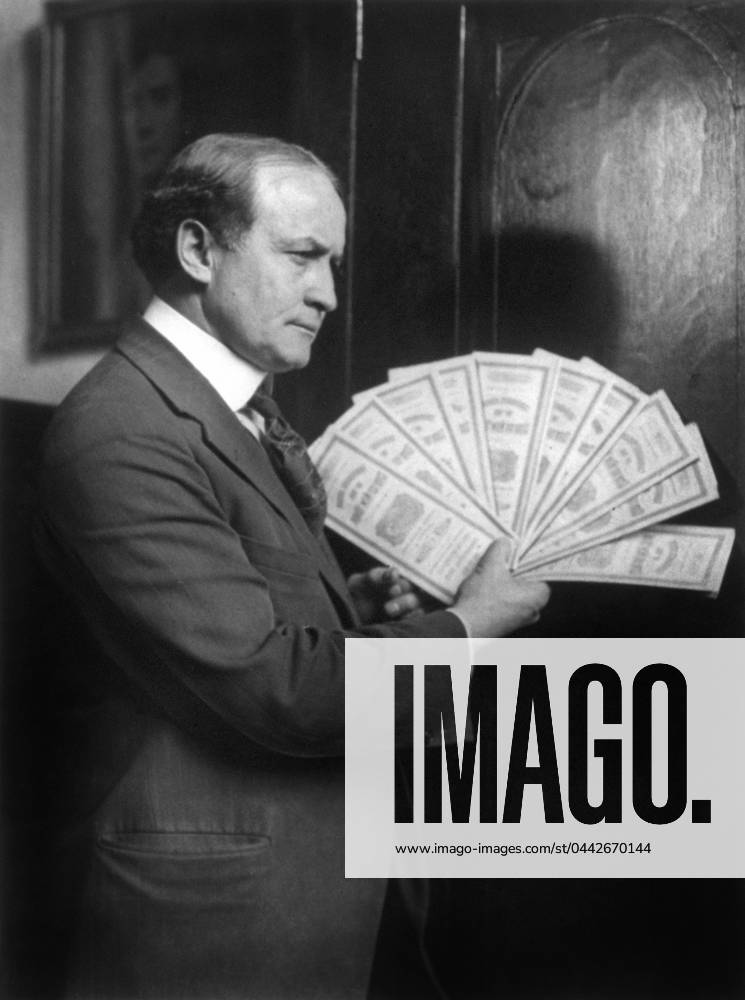 HARRY HOUDINI (1874-1926). American magician. Houdini holding $10,000 of New York City Bonds at City Hall in Boston as a guarantee that he could detect and repeat any phenomena shown by the famous psychic medium Margery Crandon. Photograph, 1924.