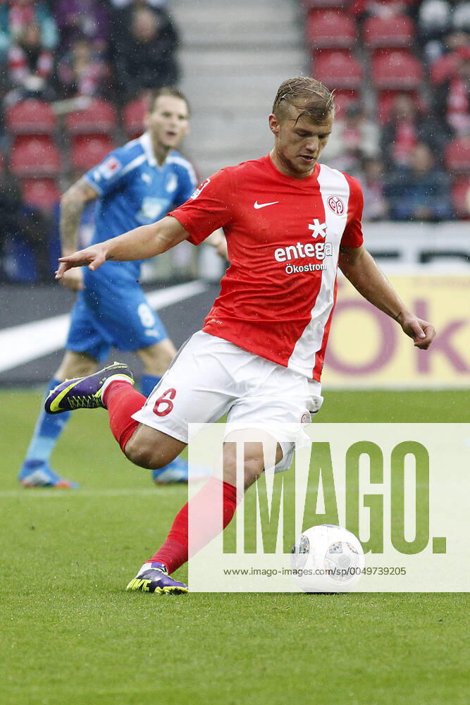 Mainz, Germany 05 October 2013 1 Bundesliga 13 14 8 Matchday 1 FSV Mainz 05 vs 1899 Hoffenheim Johannes Geis Mainz , with ball, in background Eugen Polanski Hoffenheim , tall, portrait 1 Bundesliga 13 14 8 Matchday 1 FSV Mainz 05 vs 1899 Hoffenheim jr