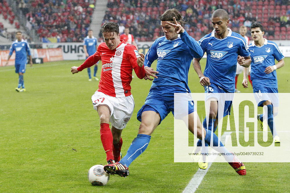 Mainz, Germany 05 October 2013 1 Bundesliga 13 14 8 Spieltag 1 FSV Mainz 05 vs 1899 Hoffenheim v le Nicolai Müller Mainz in a duel against Jannik Vestergaard Hoffenheim , in the background v le Jeremy Toljan Hoffenheim , Tarik Elyounoussi Hoffenheim , t.s., landscape 1 Bundesliga 13 14 8 Spieltag 1 FSV Mainz 05 vs 1899 Hoffenheim jr