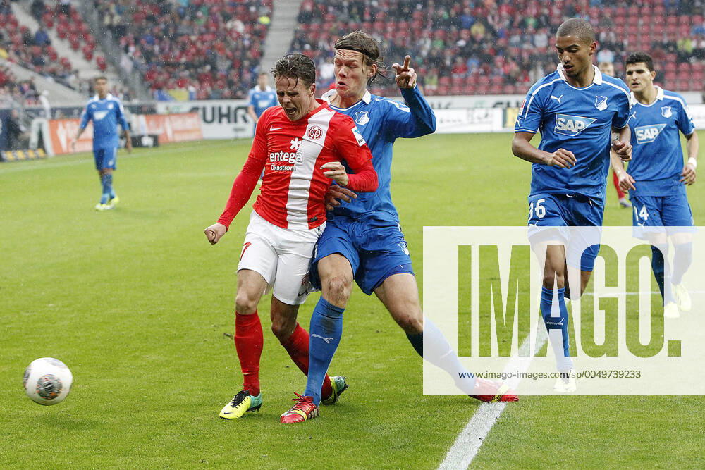 Mainz, Germany 05 October 2013 1 Bundesliga 13 14 8 Spieltag 1 FSV Mainz 05 vs 1899 Hoffenheim v le Nicolai Müller Mainz in a duel against Jannik Vestergaard Hoffenheim , in the background v le Jeremy Toljan Hoffenheim , Tarik Elyounoussi Hoffenheim , t.s., landscape 1 Bundesliga 13 14 8 Spieltag 1 FSV Mainz 05 vs 1899 Hoffenheim jr