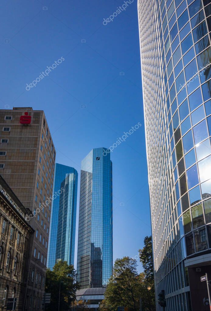 Cityscape with several bank buildings such as Deutsche Bank Twin Towers, Sparkasse, Bank of Communications in front of a blue sky
