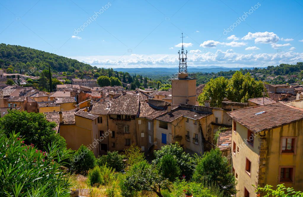 Travel destination, small ancient village Cotignac in Var, Provence, surrounded by vineyards and cliffs with troglodytes houses.