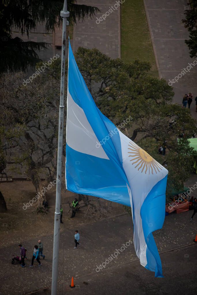 Buenos Aires, Argentina - October 25th 2019: Argentine Flag waving in the wind in downtown Buenos Aires.