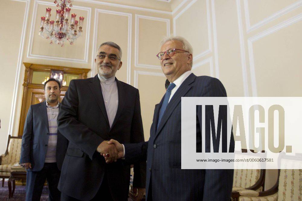 Iranian Chairman of the Parliament National Security and Foreign Policy Committee Alaeddin Boroujerdi (L) greets Hannes Swoboda, head of a European Parliament delegation, in Tehran, Iran on October 20, 2013. The delegation is expected to meet a number senior Iranian officials to explore bilateral relations. IRN20131020102