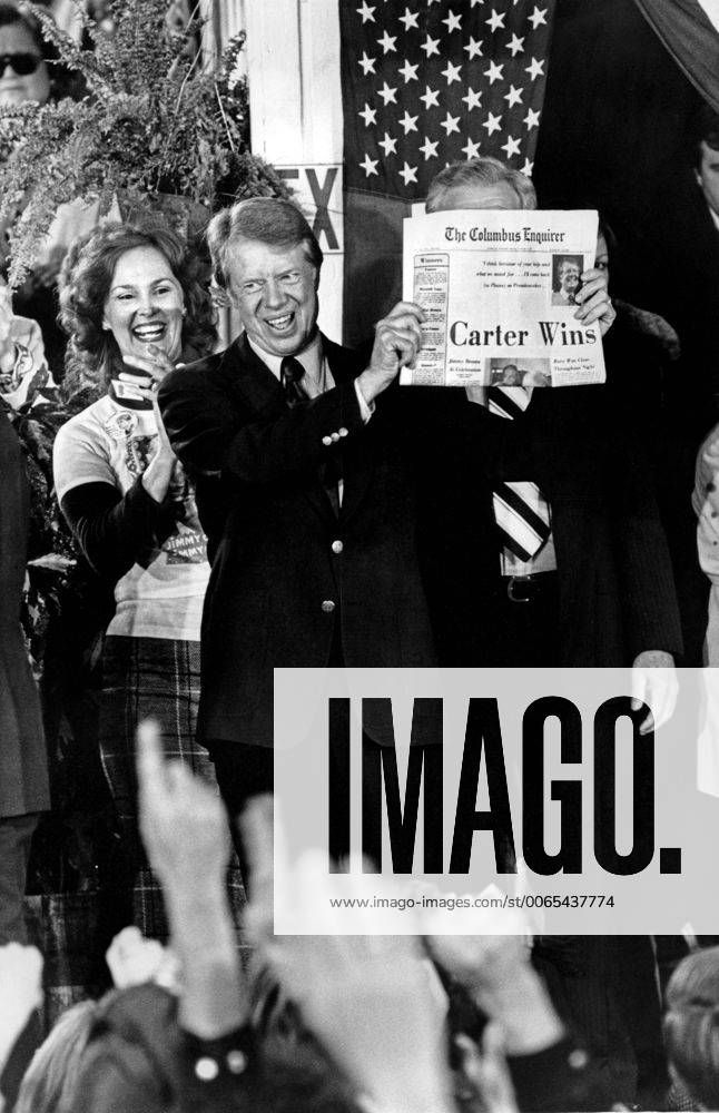 Nov. 3, 1976 - President Elect Jimmy Carter holds up a newspaper declaring Carter Wins as its headline the morning after the 1976 General Election. Carter, fariends, family and supporters jammed the streets around the railway depot in Carter s hometown of Plains, Ga. - ZUMAkh1_