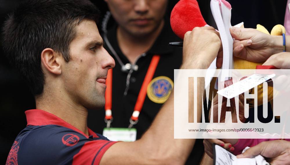 BEIJING, Oct. 9, 2010 - Novak Djokovic of Serbia signs autographs after the men s singles semifinal at the China Open tennis tournament in Beijing, capital of China