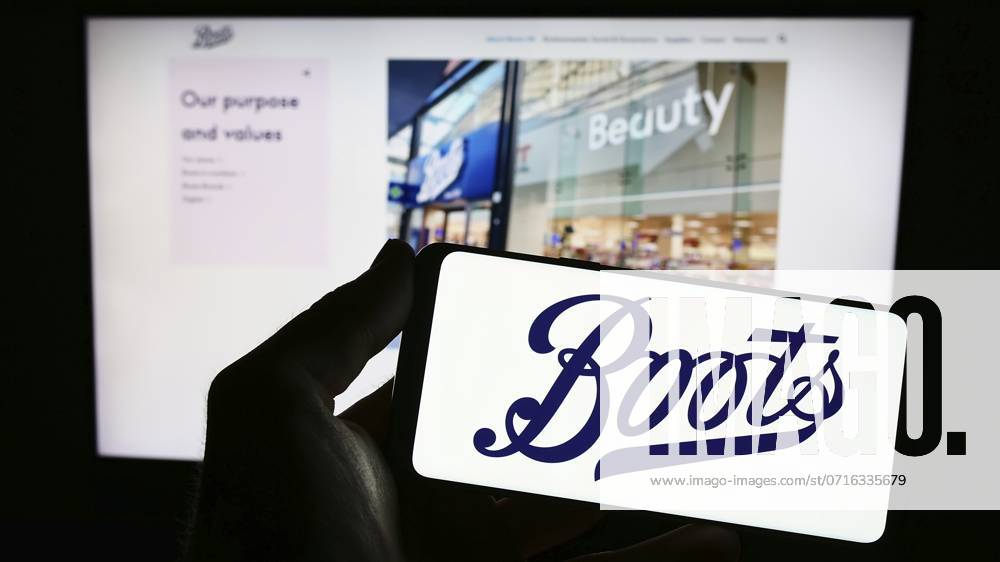 Stuttgart, Germany, 07-01-2023: Person holding smartphone with logo of British pharmacy company Boots UK Limited on screen in front of website. Focus on phone display, Europe
