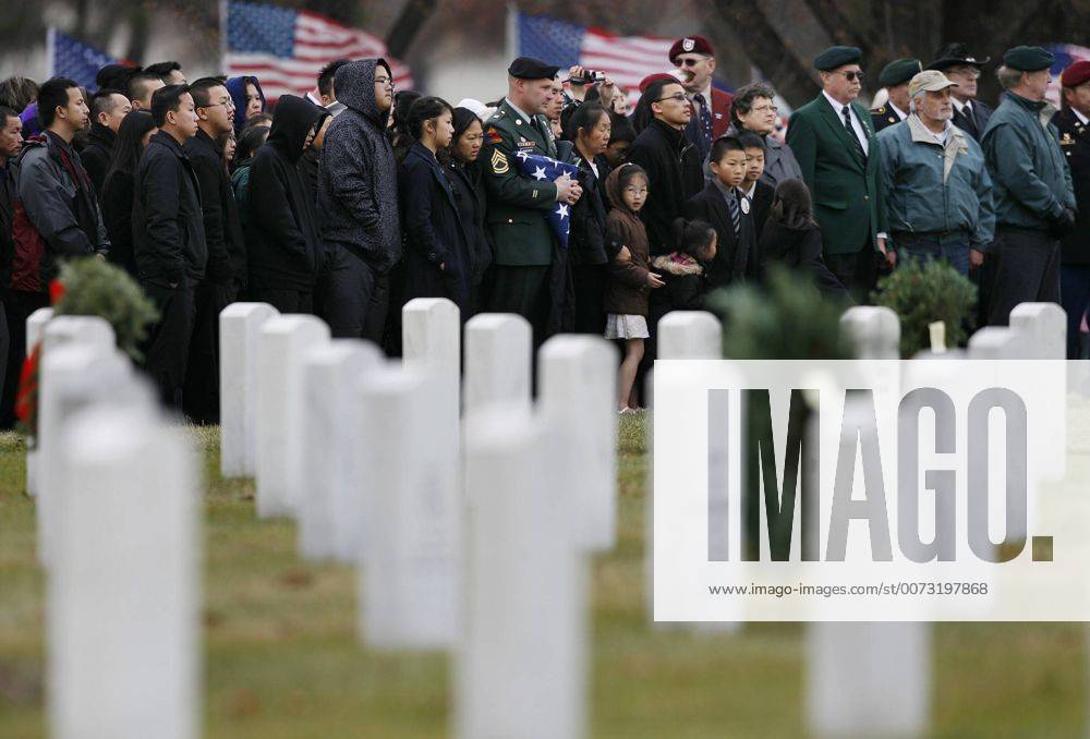 Jgholt@startribune.com---- 11 30 2009 --- Family members and friends said their goodbyes to U.S. Army Pfc. Kham Xiong Monday afternoon during his interment at Fort Snelling National Cemetery. Xiong was killed in the Nov. 5 shooting at Fort Hood TX. - ZUMAm42_