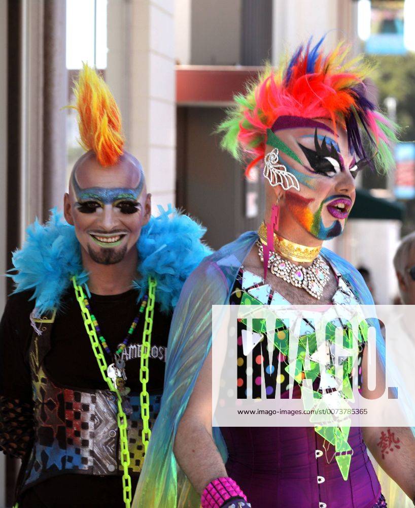 Oceanside, California, USA - 10 8 2016 Oceanside, CA_EARTH INTRUDER, left, and GLAM GLITZ, at right, make their way down Pier View Way in downtown Oceanside, California at the annual North County Pride at the Beach festival. The event was sponsored by the North County LGBTQ Resource Center. They were the event s MC s._ Photo by Oceanside USA - ZUMAn47_