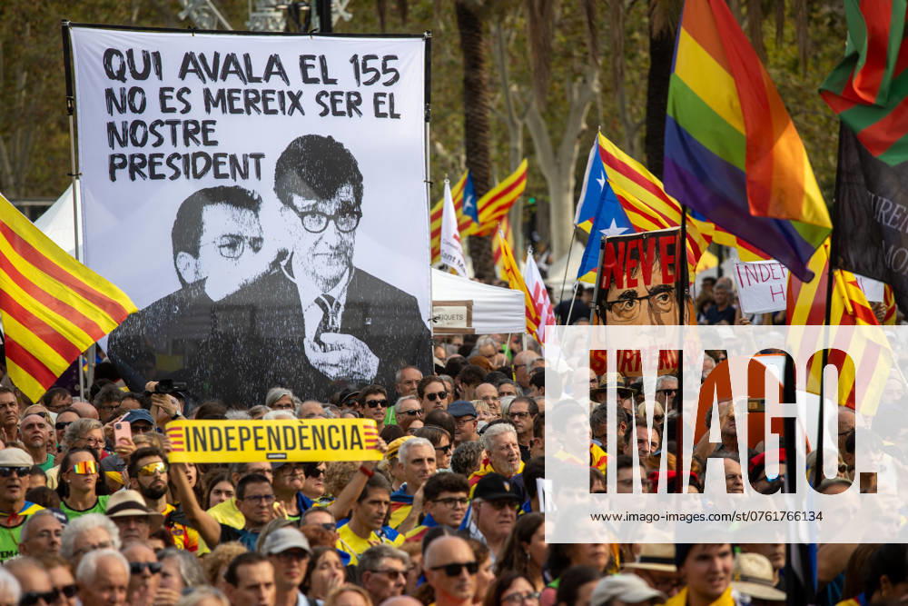 A man carries a sign with the word independence in front of a banner that says in Catalan Whoever approved 155 does not deserve to be our president with the face of the current President of the Generalitat of Catalonia, Salvador Illa (L) next to that of Pere Aragones (R), Illa s predecessor in office, to the right another protester carries a banner with the face of the former president of the generalitat, fugitive from justice, Carles Puigdemont, during the celebration of the Diada de Catalunya. As every September 11th, the Catalan National Day, also known as Catalonia Day or National Day of Catalonia, was celebrated in the city of Barcelona..In the morning, the traditional floral offering was made - ZUMAs197 20240911_aaa_s197_401