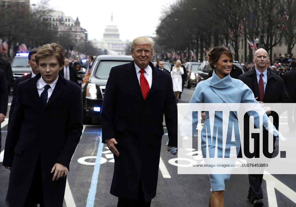 President Donald Trump walks with first lady Melania Trump and their son Barron, left, during the inauguration parade on Pennsylvania Avenue in Washington, DC on January 20, 2017. Trump became the 45th President of the United States. Pool photo by Evan Vucci WAX201701202113 EVANxVUCCI