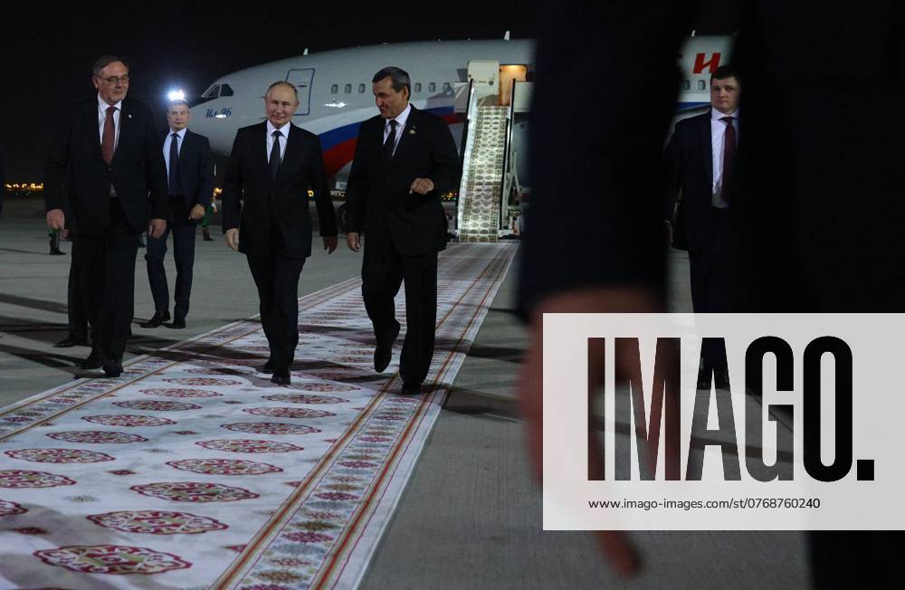 Turkmenistan Russia 8783527 11.10.2024 Russian President Vladimir Putin, accompanied by Turkmen Deputy Prime Minister - Foreign Minister Rashid Meredov and Russian Ambassador to Turkmenistan Ivan Volynkin, attends a welcome ceremony upon arrival at Ashgabat International Airport in Ashgabat, Turkmenistan. Alexander Shcherbak POOL Ashgabad Turkmenistan