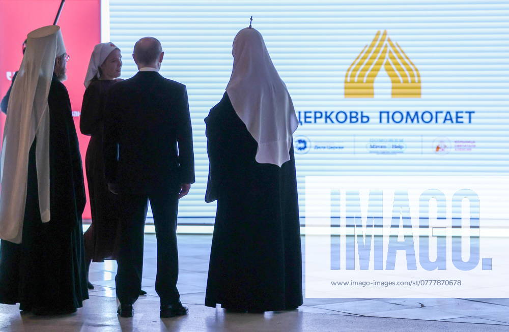 RUSSIA, MOSCOW - OCTOBER 4, 2024: Russia s President Vladimir Putin (C) attends the Orthodox Russia Marks National Unity Day religious and social exhibition and forum at the Manezh Central Exhibition Hall. Vyacheslav Prokofyev Russian President Press Office TASS 75685227