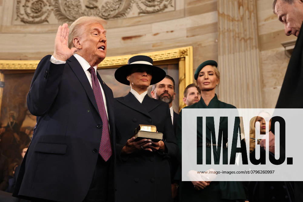 Trump and Vance Swearing-In at the US Capitol - DC President-elect Donald Trump takes the oath of office from Chief Justice John Roberts as Melania Trump, Ivanka Trump, Donald Trump Jr. and Eric Trump look on during inauguration ceremonies in the Rotunda of the U.S. Capitol on January 20, 2025 in Washington, DC. Donald Trump takes office for his second term as the 47th president of the United States. Photo by Chip Somodevilla Pool CNP ABACAPRESS.COM Washington DC United States