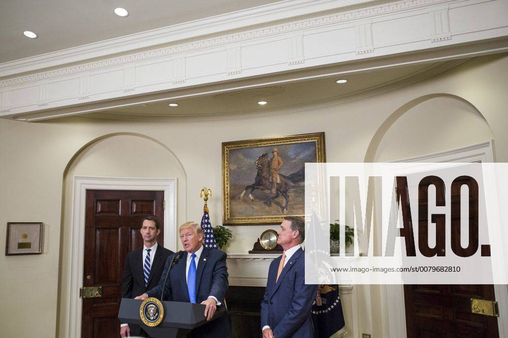 President Donald Trump makes an announcement on the introduction of the Reforming American Immigration for a Strong Economy (RAISE) Act with Sen. Tom Cotton, a Republican from Arkansas, left, and Sen. David Perdue, a Republican from Georgia, right, in the Roosevelt Room at the White House in Washington, D.C., U.S., on Wednesday, August 2, 2017. The act aims to overhaul U.S. immigration by moving towards a merit-based system. WAX20170802152 ZachxGibson