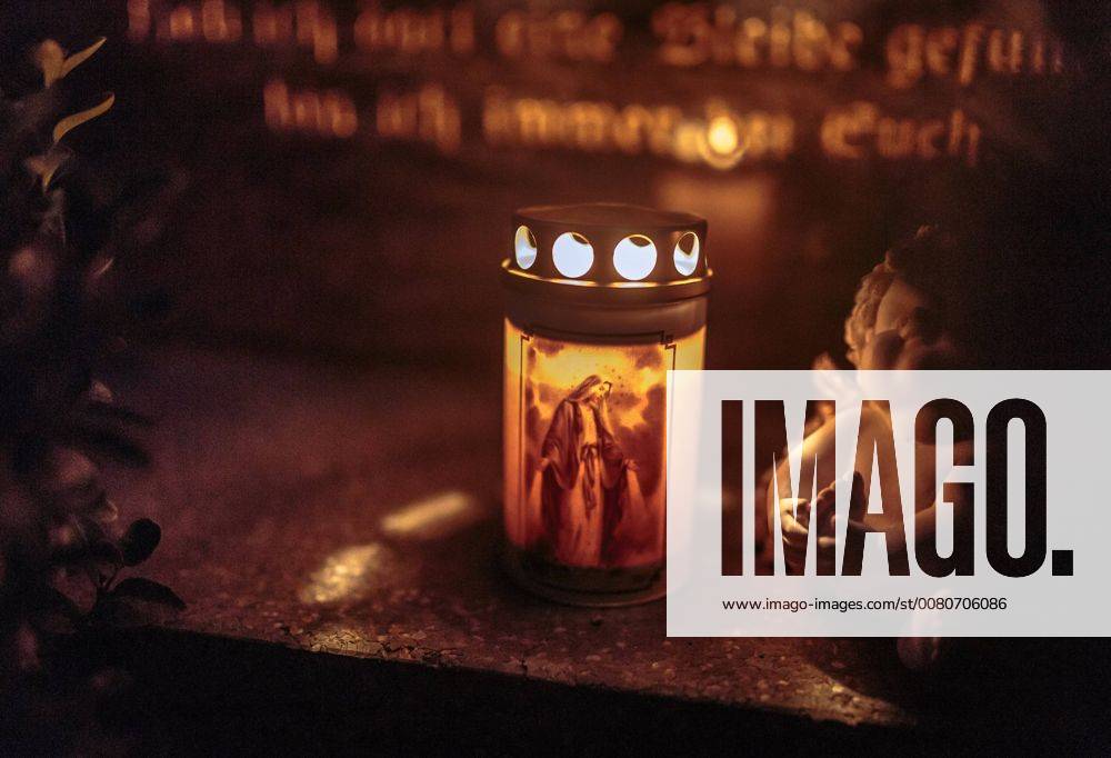 Kaprun Theme image All Saints u0026 39; Day and All Souls u0026 39; Day a Burning Candle with Trauerengel on a Grave stone at 1 November Remembrance Catholics all People the in the EP_obh
