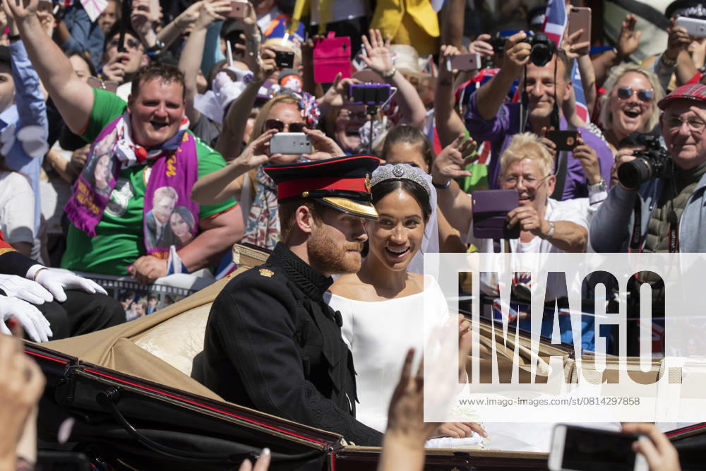 Prince Harry, Duke of Sussex and Megan Duchess of Sussex Prince Harry, Duke of Sussex and Megan Duchess of Sussex in the Ascot Landau Carriage as their carriage procession rides along the Long Walk, on May 19, 2018 after their wedding ceremony. CAP NW Nick Watts Windsor England UK