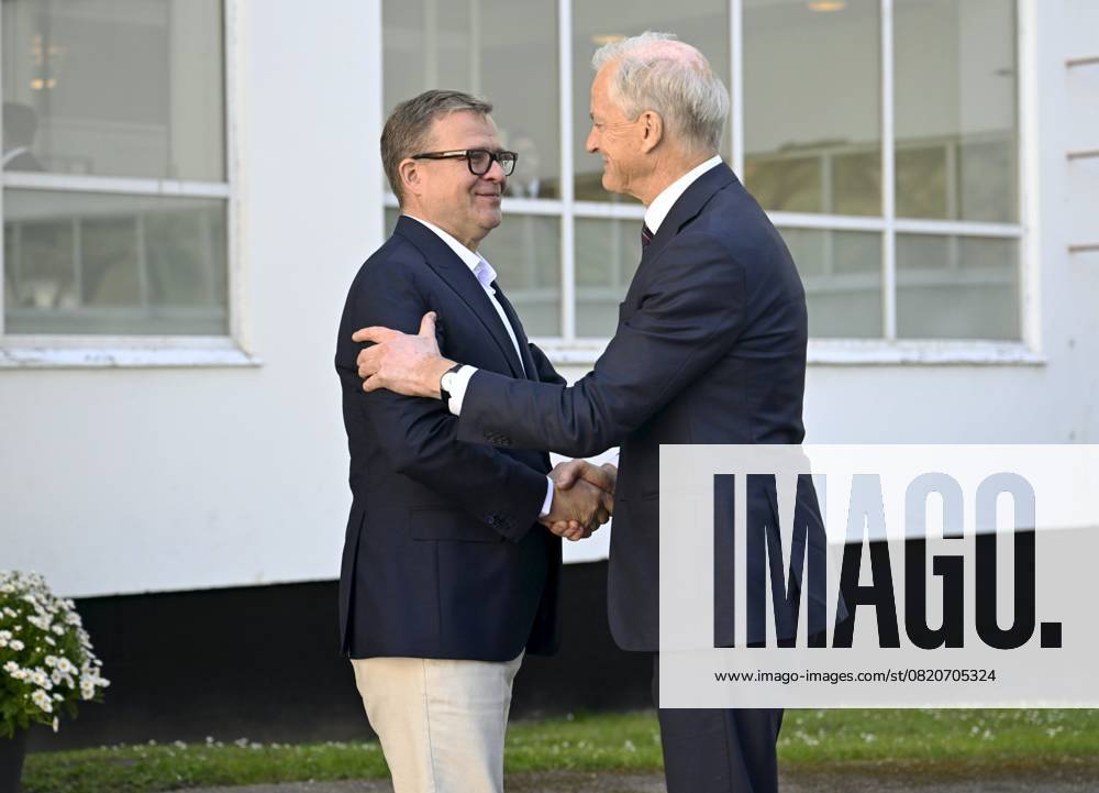 Finnish Prime Minister Petteri Orpo (L) welcomes Norwegian Prime Minister Jonas Gahr Störe at the Nordic Prime Ministers Summer Meeting at the Paimio Sanatorium in Paimio, Finland, on May 26, 2025. Finland and Åland together host the informal summer meeting. The discussions of the meeting will focus on two themes: competitiveness and strengthening comprehensive security. Paimio Finland