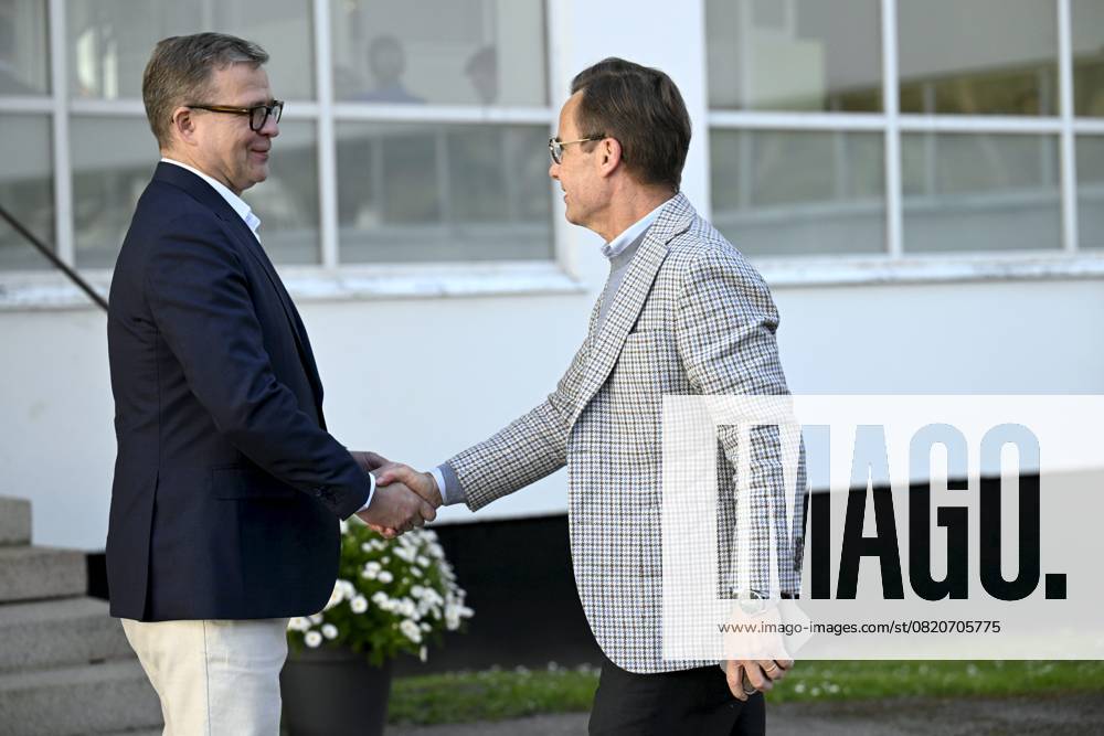 Finnish Prime Minister Petteri Orpo (L) welcomes Swedish Prime Minister Ulf Kristersson at the Nordic Prime Ministers Summer Meeting at the Paimio Sanatorium in Paimio, Finland, on May 26, 2025. Finland and Åland together host the informal summer meeting. The discussions of the meeting will focus on two themes: competitiveness and strengthening comprehensive security. Paimio Finland