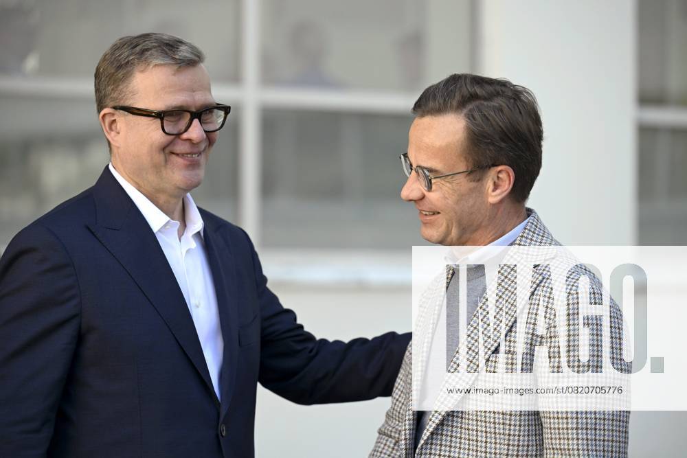 Finnish Prime Minister Petteri Orpo (L) welcomes Swedish Prime Minister Ulf Kristersson at the Nordic Prime Ministers Summer Meeting at the Paimio Sanatorium in Paimio, Finland, on May 26, 2025. Finland and Åland together host the informal summer meeting. The discussions of the meeting will focus on two themes: competitiveness and strengthening comprehensive security. Paimio Finland