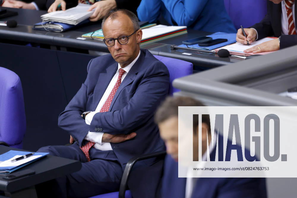 Federal Chancellor Friedrich Merz CDU listens to Federal Finance Minister Lars Klingbeil SPD in the German Bundestag during his speech on the draft Budget Act 2025 Berlin, 08 07 2025 Berlin Capital Germany