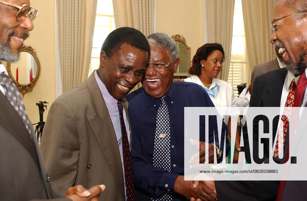 War-Torn Grenada, A Nation Rebuilds Jun 25, 2003; St. George, GRENADA; Grenada Prime Minister KEITH MITCHELL chats with friends and local supporters during a swearing in of a senator at the governor s mansion in St. George, Grenada. St. George GRENADA