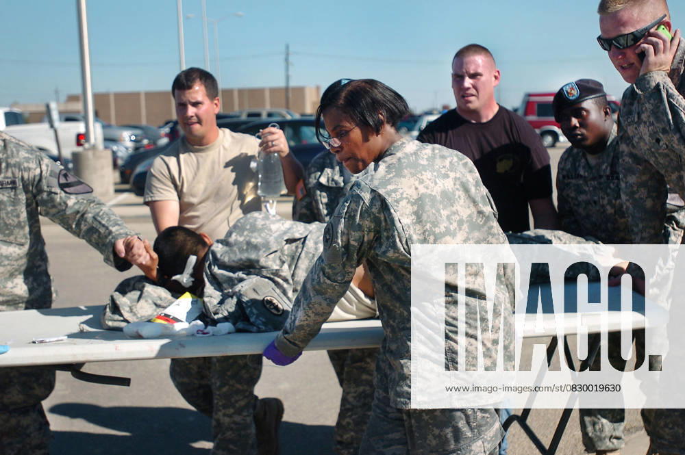 Fort Hood Shooting 13 Dead 30 Wounded Nov. 05, 2009 - Fort Hood, Texas, U.S. - First responders use a table as a stretcher to transport a wounded Soldier to an awaiting ambulance at Fort Hood.