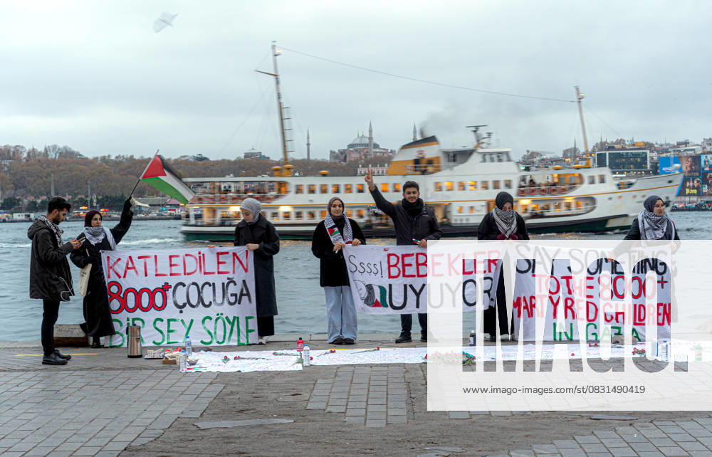 Pro-Palestinian demonstration in Istanbul ISTANBUL, TURKIYE - DECEMBER 06: People, holding banners and placards, condemn Israeli attacks over Gaza during pro-Palestinian demonstration in Karakoy beach of Istanbul, Turkiye on December 06, 2023. Istanbul Turkey. Editorial use only. Please get in touch for any other usage.