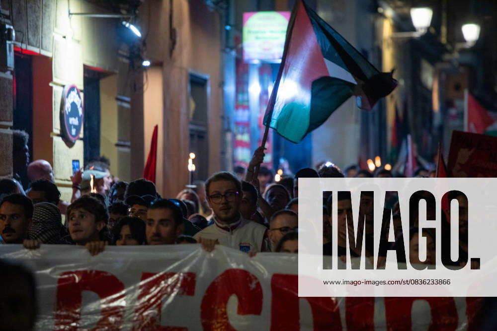Protesters hold Palestinian flags during a pro-Palestinian demonstration in the Lavapiàs neighborhood of Madrid. Madrid Spain - ZUMAs197 20251003_aaa_s197_526