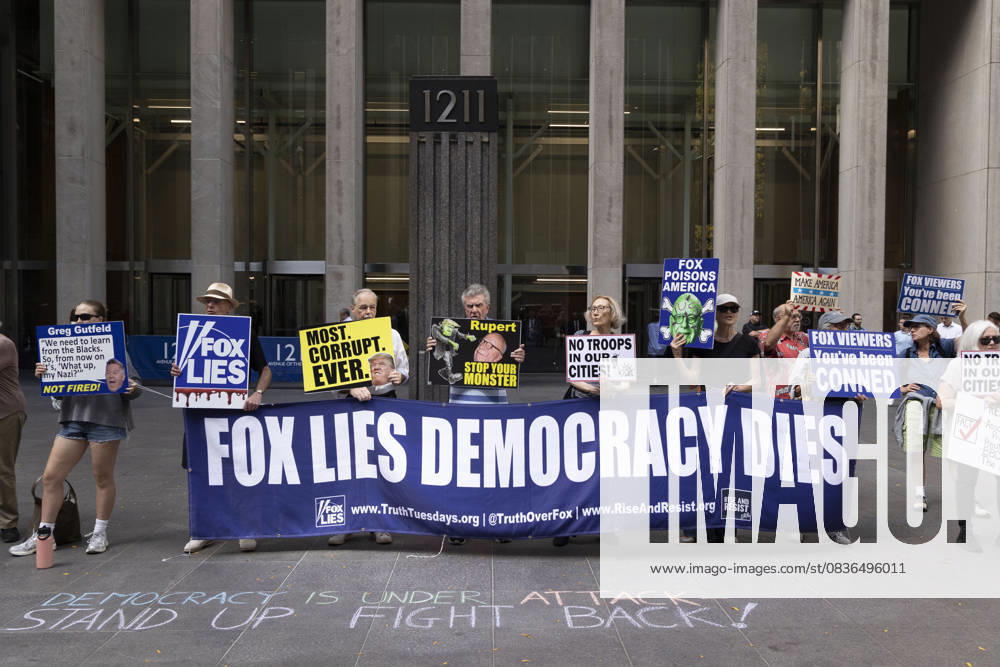 Demonstrators denouncing Fox News as extremist right-wing propaganda in support of President Trump s administration hold a banner and signs that read FOX LIES DEMOCRACY DIES MOST. CORRUPT. EVER. with an image of President Trump Rupert STOP YOUR MONSTER NO TROOPS IN OUR CITIES! FOX POISONS AMERICA FOX VIEWERS You ve been CONNED outside of News Corp s Fox News Channel in midtown Manhattan. Chalking on the plaza reads DEMOCRACY IS UNDER ATTACK STAND UP FIGHT BACK! Protesters with the activist groups Rise & Resist and Truth Tuesdays come to Fox News weekly for a peaceful demonstration calling for truth in journalism and denouncing authoritarianism, oligarchy, fascism, and Trump s agenda. - ZUMAr174 20251007_znp_r174_006