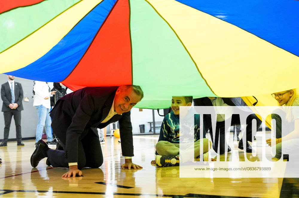 Ottawa, On, CAN: Prime Minister Mark Carney plays a parachute game with children at a community centre, before participating in an announcement in Ottawa, on Friday, Oct. 10, 2025. Ottawa CAN - ZUMAc35_ 20251010_zaf_c35_006