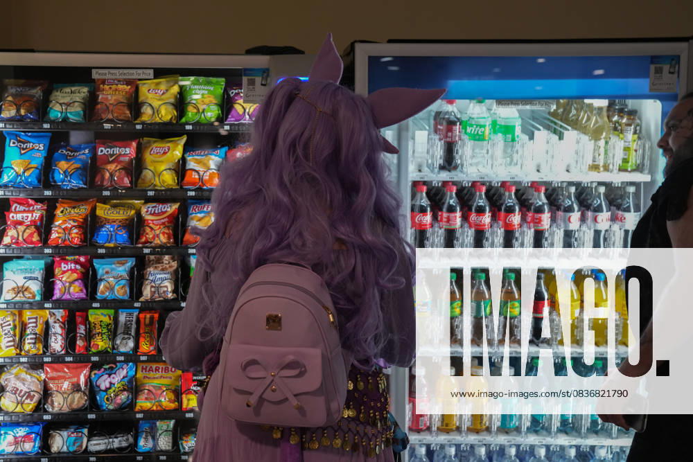 An attendee in cosplay looks over drinks at a vending machine at the New York Comic Con at the Jacob K. Javits Convention Center on October 10, 2025 in New York. New York USA - ZUMAb148 20251010_zap_b148_008