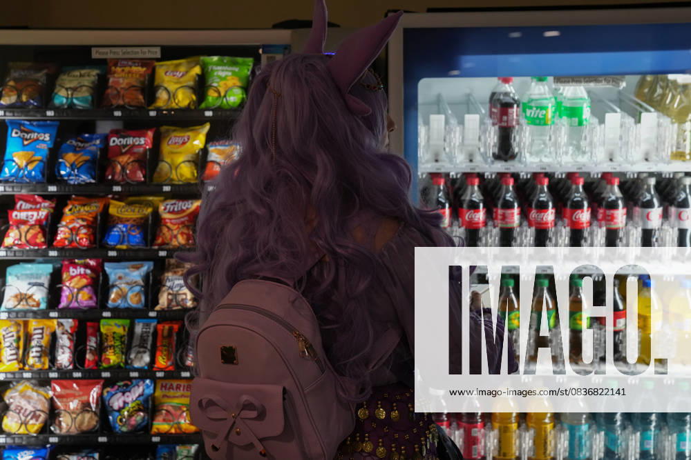 An attendee in cosplay looks over drinks at a vending machine at the New York Comic Con at the Jacob K. Javits Convention Center on October 10, 2025 in New York. New York USA - ZUMAb148 20251010_zap_b148_021