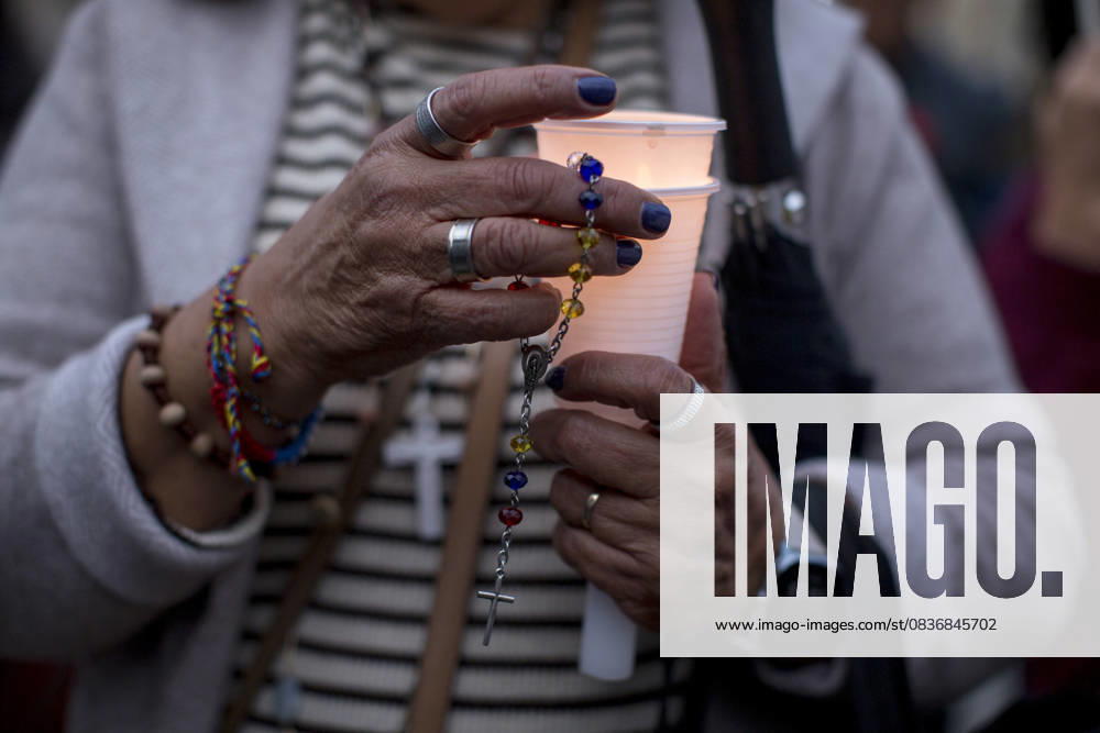 Members of the Venezuelan community in Madrid holding candles and Venezuelan flags in Opera Square in downtown Madrid, during a vigil to pray the rosary for the beatification of Venezuelans Jose Gregorio Hernandez and Carmen Rendiles on October 19, 2027, in St. Peter s Square, Rome. Madrid Spain - ZUMAs296 20251011_znp_s296_002