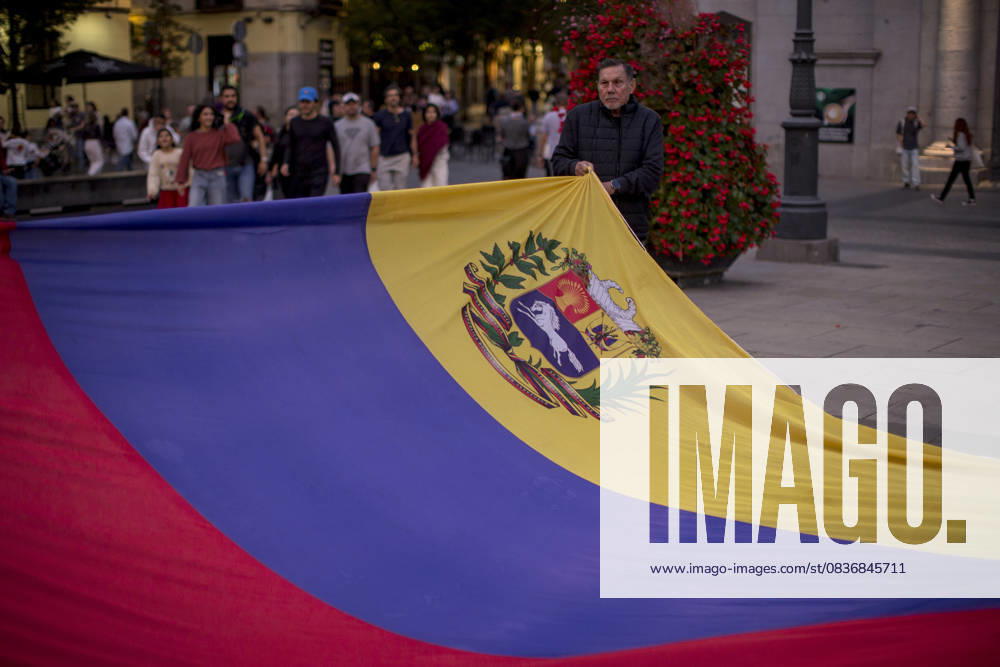 Members of the Venezuelan community in Madrid holding candles and Venezuelan flags in Opera Square in downtown Madrid, during a vigil to pray the rosary for the beatification of Venezuelans Jose Gregorio Hernandez and Carmen Rendiles on October 19, 2027, in St. Peter s Square, Rome. Madrid Spain - ZUMAs296 20251011_znp_s296_014