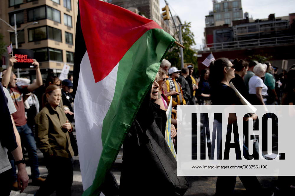 Protesters march down Broadway during the â€oeNo Kings†rally in New York, Saturday, Oct. 18, 2025. The demonstration began in Times Square and ended in Union Square, drawing an estimated 50,000 people who joined others across the country calling for the protection of democratic institutions and denouncing authoritarian leadership. Organizers said more than 5 million people participated in over 2,000 marches nationwide. New York USA - ZUMAa306 20251018_znp_a306_009