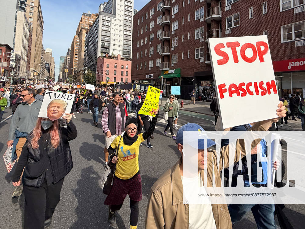 Protesters march in the No Kings Protest against the Trump administration down Seventh Avenue in Chelsea on October 18, 2025 in New York. New York USA - ZUMAb148 20251018_zap_b148_005