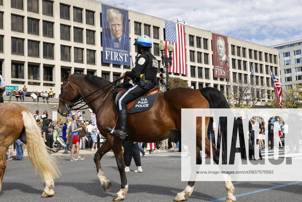 United States Park Police members are seen while demonstrators take part in a protest against the Donald Trump administration during the No Kings national rally on October 18, 2025, in Washington, DC, USA. Millions of people across the nation joined the No Kings protest to demonstrate their disapproval of the current US administration. The No Kings Day of Defiance has been organized to reject authoritarianism, billionaire-first politics, and the militarization of the countryÃ¢â‚¬â ¢s democracy, according to a statement by organizers. Washington Dc USA - ZUMAk203 20251018_znp_k203_037