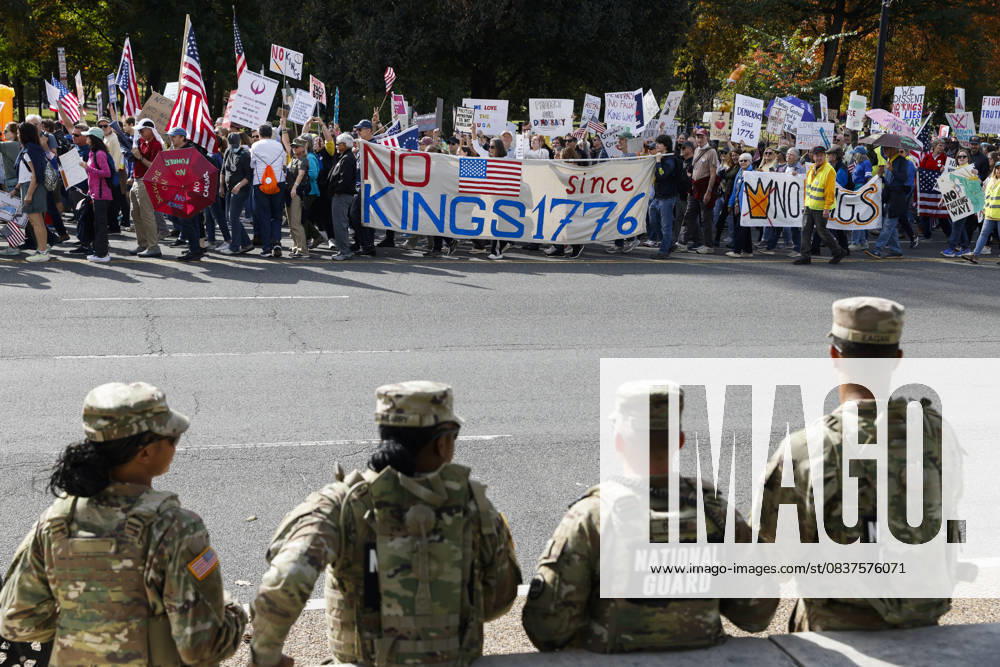 National Guard members are seen while demonstrators take part in a protest against the Donald Trump administration during the No Kings national rally on October 18, 2025, in Washington, DC, USA. Millions of people across the nation joined the No Kings protest to demonstrate their disapproval of the current US administration. The No Kings Day of Defiance has been organized to reject authoritarianism, billionaire-first politics, and the militarization of the countryâ€⠢s democracy, according to a statement by organizers. Washington Dc USA - ZUMAk203 20251018_znp_k203_018