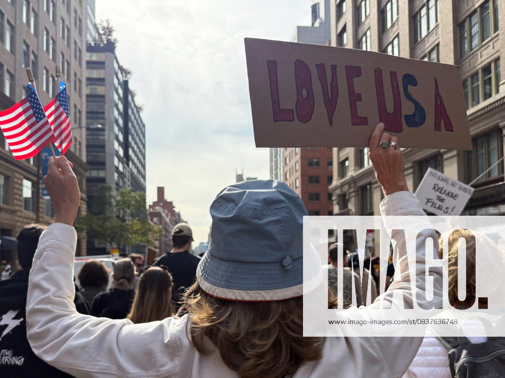 Protesters march in the No Kings Protest against the Trump administration down Seventh Avenue in Chelsea on October 18, 2025 in New York. New York USA - ZUMAb148 20251018_zap_b148_006
