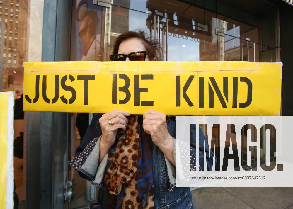 A woman holds a sign that says Be Kind during the No Kings protest in New York City on Oct. 18, 2025. Tens of thousands of people hit New York City streets to protest Donald Trump, autocracy, ICE and immigrant deportations. More than 2,500 similar protests took place nationwide. New York City USA - ZUMAk45_ 20251018_zaf_k45_050