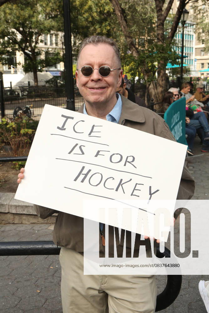 A man holds a sign that says ICE is for Hockey during the No Kings protest in New York City on Oct. 18, 2025. Tens of thousands of people hit New York City streets to protest Donald Trump, autocracy, ICE and immigrant deportations. More than 2,500 similar protests took place nationwide. New York City USA - ZUMAk45_ 20251018_zaf_k45_054